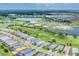 Aerial shot featuring a community with golf course, pool, clubhouse and many homes at 15813 San Lazzaro Ave, Bradenton, FL 34211