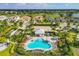 Aerial view of a community pool, lush landscaping, and surrounding homes at 15813 San Lazzaro Ave, Bradenton, FL 34211