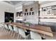 Large gathering space offering stylish seating, a fireplace feature, wine storage, and sophisticated lighting for social events at 15813 San Lazzaro Ave, Bradenton, FL 34211