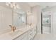 Bathroom showcasing double vanity, quartz countertops, modern lighting and hardware at 15813 San Lazzaro Ave, Bradenton, FL 34211