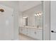 Bright bathroom featuring a double vanity, quartz countertops, and modern fixtures at 15813 San Lazzaro Ave, Bradenton, FL 34211