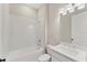 Clean bathroom with tub and shower combo, a white vanity and toilet at 15813 San Lazzaro Ave, Bradenton, FL 34211