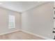 Bright bedroom features a window, modern recessed lighting and sleek plank flooring at 15813 San Lazzaro Ave, Bradenton, FL 34211