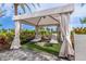 Secluded poolside cabana offering shade and comfortable seating for luxurious relaxation at 15813 San Lazzaro Ave, Bradenton, FL 34211