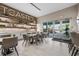 Cafe seating area with tables and chairs, stylish decor, and easy access to the outdoors at 15813 San Lazzaro Ave, Bradenton, FL 34211