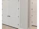 This spacious closet features white doors and matte black hardware at 15813 San Lazzaro Ave, Bradenton, FL 34211