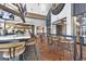 Upscale clubhouse bar featuring a marble countertop, bar stools, and wall mounted television sets at 15813 San Lazzaro Ave, Bradenton, FL 34211