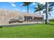 Large stone sign with community name surrounded by green lawn and palm trees at 15813 San Lazzaro Ave, Bradenton, FL 34211