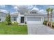 This is a charming single-Gathering home with a manicured lawn and beautiful landscaping at 15813 San Lazzaro Ave, Bradenton, FL 34211