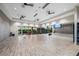 Bright fitness studio with hardwood floors, mirrors, weights, and ceiling fans at 15813 San Lazzaro Ave, Bradenton, FL 34211