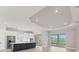 Modern kitchen featuring a large island, stainless steel appliances, and access to the backyard at 15813 San Lazzaro Ave, Bradenton, FL 34211