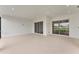 Spacious lanai with recessed lighting and sliding glass doors that overlook the lawn at 15813 San Lazzaro Ave, Bradenton, FL 34211