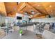 Bright restaurant featuring ceiling fans, wooden decor, bar and comfortable seating options at 15813 San Lazzaro Ave, Bradenton, FL 34211