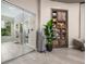Relaxing spa area featuring a glass-walled room, wooden cabinet and sleek tile flooring at 15813 San Lazzaro Ave, Bradenton, FL 34211