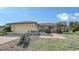 Inviting single-Gathering home with a tile roof, attached garage, and brick pathway at 1677 Fleetwood Dr, Sarasota, FL 34232