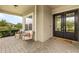 Welcoming front porch featuring a cozy seating area and a decorative double-door entrance at 17204 Bullhorn Cir, Punta Gorda, FL 33982