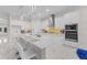 Open-concept kitchen featuring stainless steel appliances, a large island with seating, and ample counter space at 17204 Bullhorn Cir, Punta Gorda, FL 33982