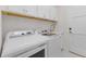 Convenient laundry room with modern washer and dryer units, plus ample storage space at 17204 Bullhorn Cir, Punta Gorda, FL 33982