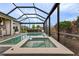 This outdoor swimming pool is perfect for relaxation with an attached hot tub and screened in lanai at 17204 Bullhorn Cir, Punta Gorda, FL 33982