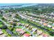 Stunning aerial view of homes along canals, showcasing waterfront living and lush greenery at 175 Inlets Blvd # 175, Nokomis, FL 34275