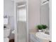 Simple bathroom featuring walk-in shower, toilet and sink at 175 Inlets Blvd # 175, Nokomis, FL 34275