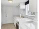 Bright laundry room with modern appliances and plenty of counter space at 175 Inlets Blvd # 175, Nokomis, FL 34275