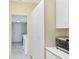Laundry room with plenty of storage cabinets and a view to the washer and dryer at 175 Inlets Blvd # 175, Nokomis, FL 34275