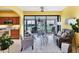 Open-concept sunroom with sliding glass doors, stylish furnishings, and lots of natural light at 175 Inlets Blvd # 175, Nokomis, FL 34275
