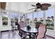 Sunroom with lots of windows for natural light, tile floor, and view of the water at 175 Inlets Blvd # 175, Nokomis, FL 34275