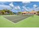 Community tennis courts surrounded by trees and landscaping, offering recreational opportunities at 175 Inlets Blvd # 175, Nokomis, FL 34275