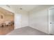 Empty bedroom showing carpeted floor and an open door to the dining area at 17817 Pastureland Ave, Lakewood Ranch, FL 34211