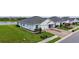 Beautiful single Gathering home with manicured lawn, lake, and brick driveway at 17817 Pastureland Ave, Lakewood Ranch, FL 34211