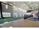Community gym with indoor sports area, including golf practice and fitness equipment for residents' enjoyment at 17817 Pastureland Ave, Lakewood Ranch, FL 34211