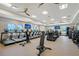 Spacious gym featuring state of the art treadmills and weights with fan and large windows at 17817 Pastureland Ave, Lakewood Ranch, FL 34211