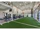 Indoor gym with turf, workout equipment, and high ceilings at 17817 Pastureland Ave, Lakewood Ranch, FL 34211