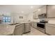 Well-appointed kitchen overlooking dining area and backyard at 17817 Pastureland Ave, Lakewood Ranch, FL 34211