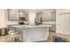 Bright eat-in kitchen features stainless appliances, granite counters, and breakfast bar at 17817 Pastureland Ave, Lakewood Ranch, FL 34211