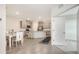 Bright open kitchen with a large island, modern appliances, and dining space at 17817 Pastureland Ave, Lakewood Ranch, FL 34211