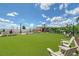 Outdoor entertainment lawn with seating, ideal for residents to enjoy community events and relaxation at 17817 Pastureland Ave, Lakewood Ranch, FL 34211
