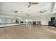 Bright yoga studio with ceiling fans, wood floors, and views of the community at 17817 Pastureland Ave, Lakewood Ranch, FL 34211