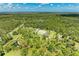 Lush home grounds with pond and wooded backdrop at 20207 71St E Ave, Bradenton, FL 34211