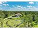 Beautiful home surrounded by lush greenery, featuring a picturesque pond at 20207 71St E Ave, Bradenton, FL 34211