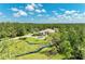 Overhead shot showcasing the house, driveway, and scenic pond at 20207 71St E Ave, Bradenton, FL 34211