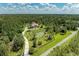 Breathtaking aerial view of an estate, showcasing landscaping and surrounding natural beauty at 20207 71St E Ave, Bradenton, FL 34211