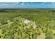 Home nestled in dense foliage with a scenic pond at 20207 71St E Ave, Bradenton, FL 34211