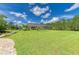 Expansive backyard with a large screened patio and well-maintained green grass at 20207 71St E Ave, Bradenton, FL 34211