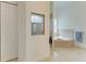 Bathroom with a large soaking tub, tiled floors, and a glass-enclosed shower at 20207 71St E Ave, Bradenton, FL 34211