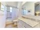 Bright bathroom with a marble vanity top, blue and white striped shower curtain, and modern finishes at 20207 71St E Ave, Bradenton, FL 34211