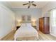 Bright bedroom with ceiling fan, closet, and coordinating furniture at 20207 71St E Ave, Bradenton, FL 34211