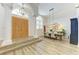Spacious dining area with wood floors, large windows, high ceilings, and a decorative light fixture at 20207 71St E Ave, Bradenton, FL 34211
